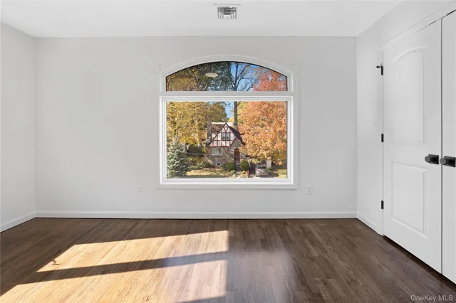 a bathroom with a sink a toilet and a large mirror