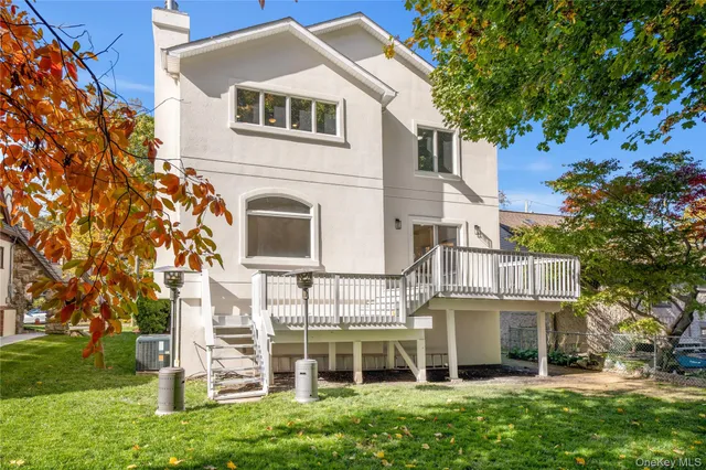 a view of outdoor space with deck and yard