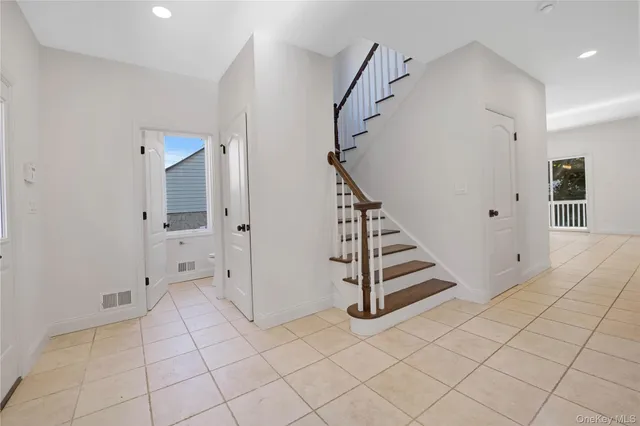 a view of an entryway with staircase