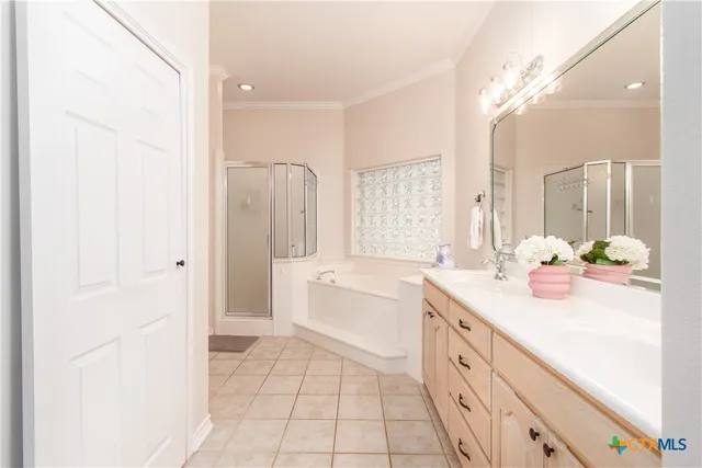 a spacious bathroom with a granite countertop sink a toilet a mirror and shower