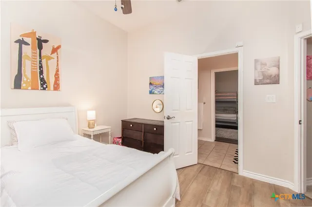 a bedroom with a bed and a dresser