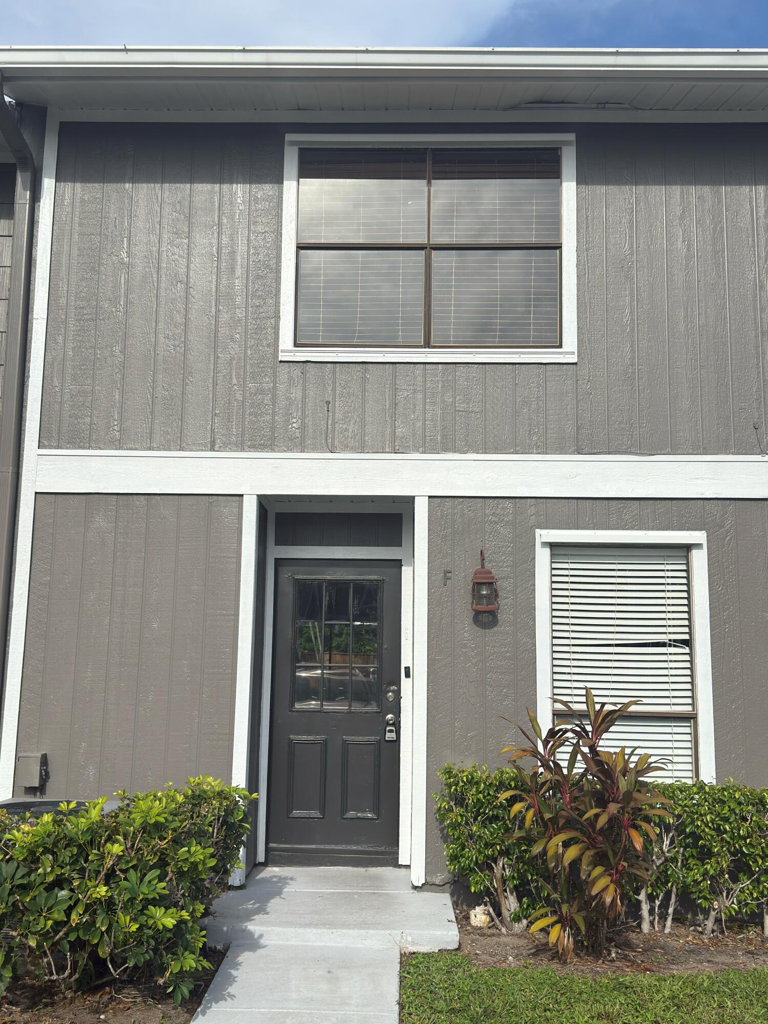 799 Hill Drive, Unit F West Palm Beach, FL 33415 - Photo 1 of 14 a front view of a house