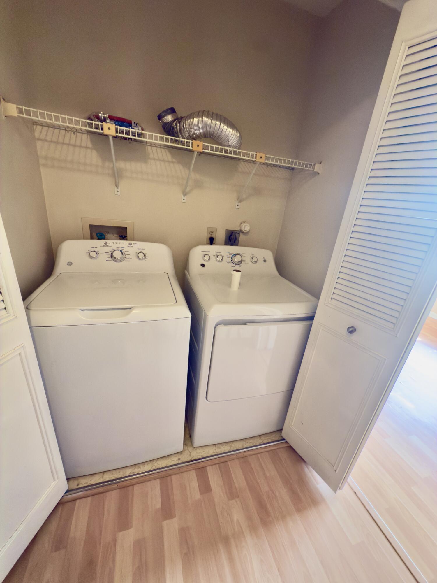 799 Hill Drive, Unit F West Palm Beach, FL 33415 - Photo 13 of 14 a utility room with dryer and washer