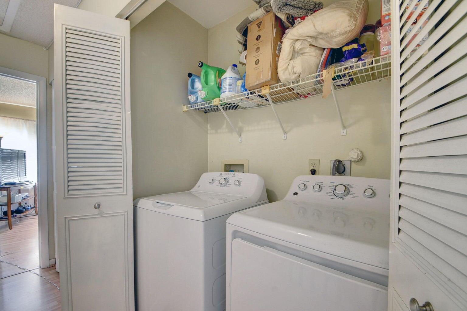 799 Hill Drive, Unit F West Palm Beach, FL 33415 - Photo 14 of 14 a utility room with dryer and washer