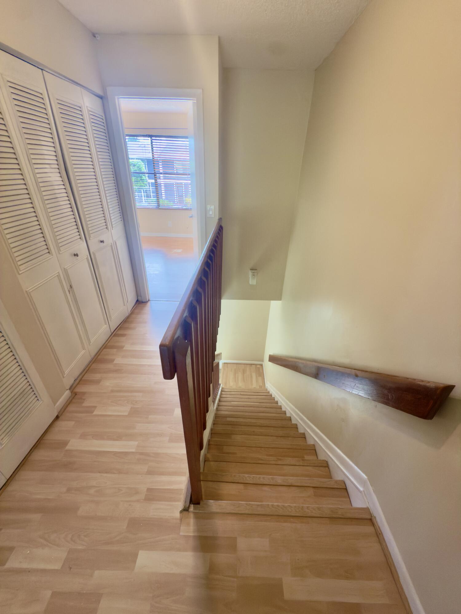 799 Hill Drive, Unit F West Palm Beach, FL 33415 - Photo 5 of 14 a view of entryway and hall with wooden floor