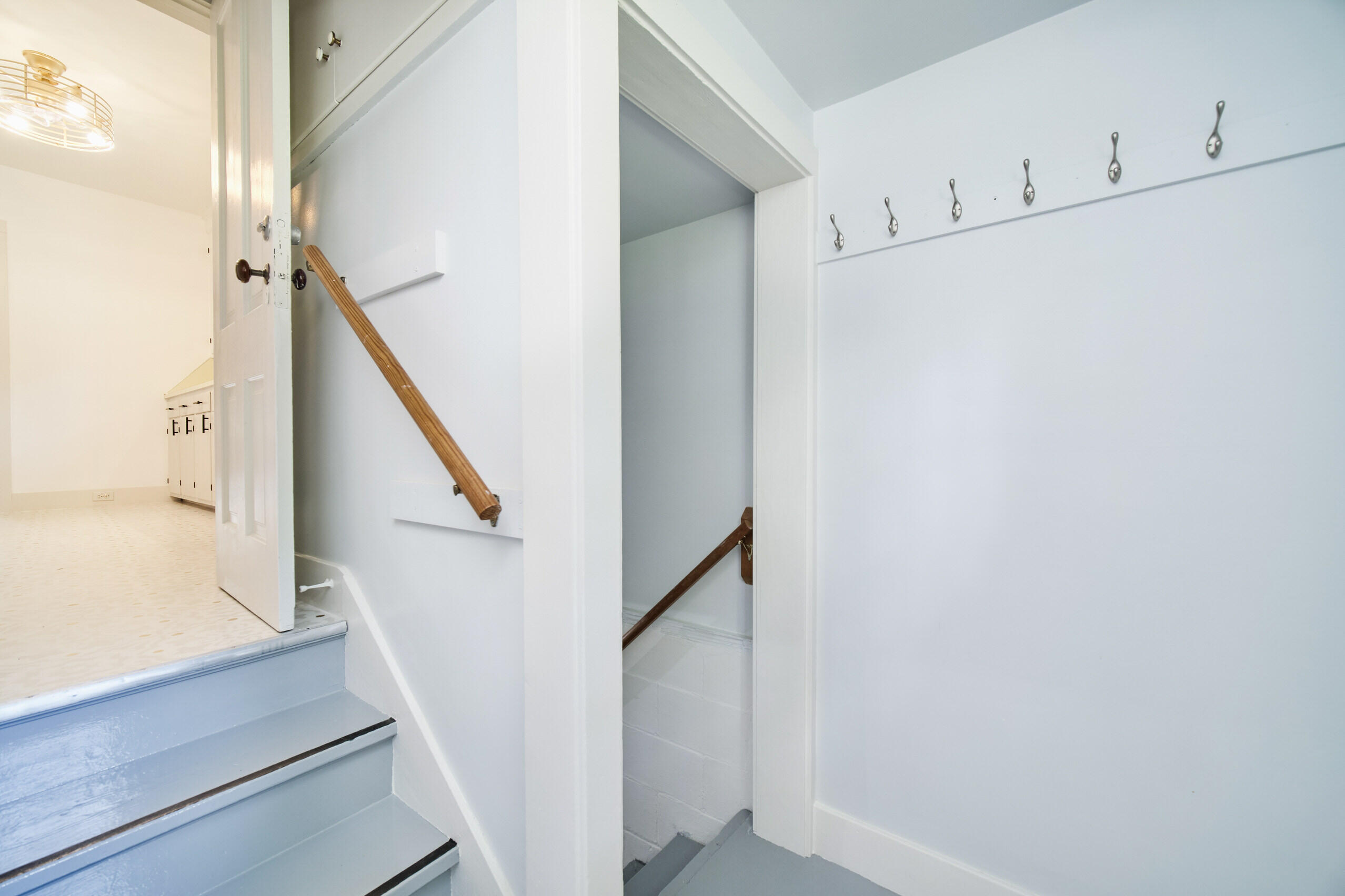 244 5th Street Manistee, MI 49660 - Photo 33 of 45 Main floor mud roomw/stairs to basement