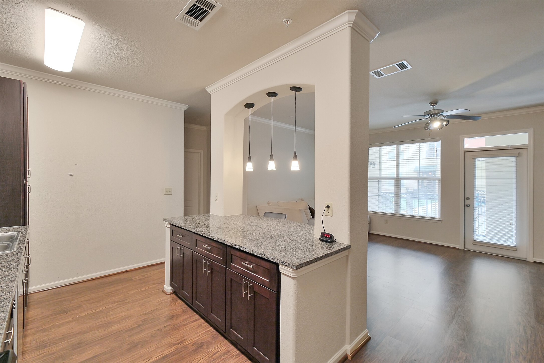 1711 Old Spanish Trail, Unit 128 Houston, TX 77054 - Photo 11 of 26 a view of a kitchen cabinets and wooden floor