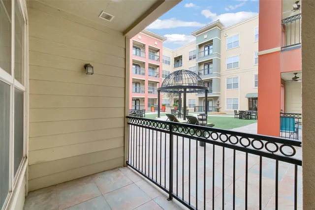 a view of a brick building from a balcony