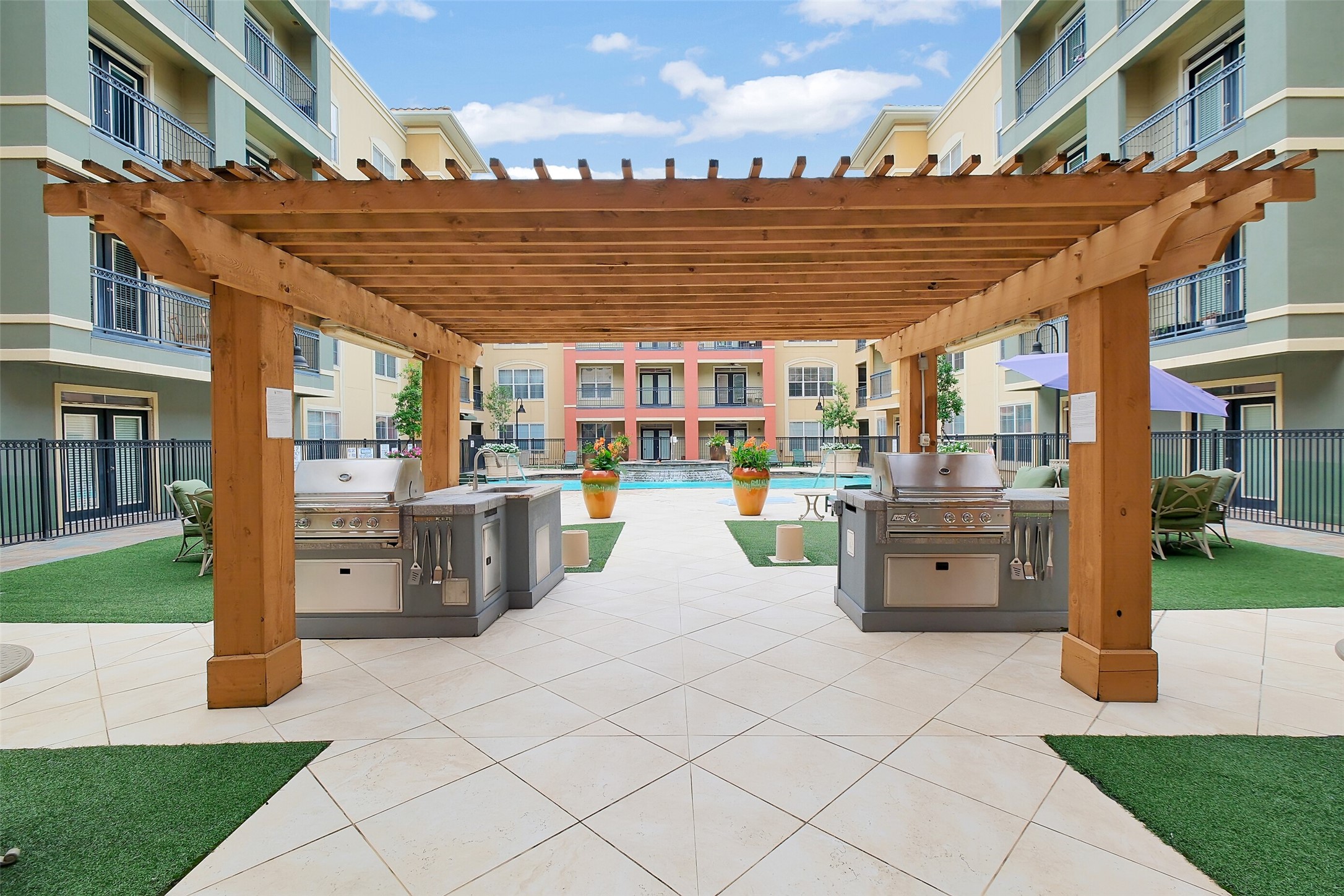 1711 Old Spanish Trail, Unit 128 Houston, TX 77054 - Photo 22 of 26 a view of a patio with table and chairs
