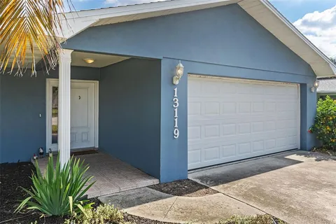 a couple of potted plants in front of door
