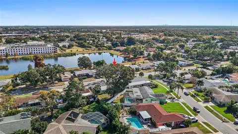 an aerial view of a house with outdoor space