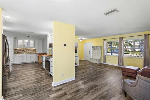 a view of kitchen with furniture and wooden floor