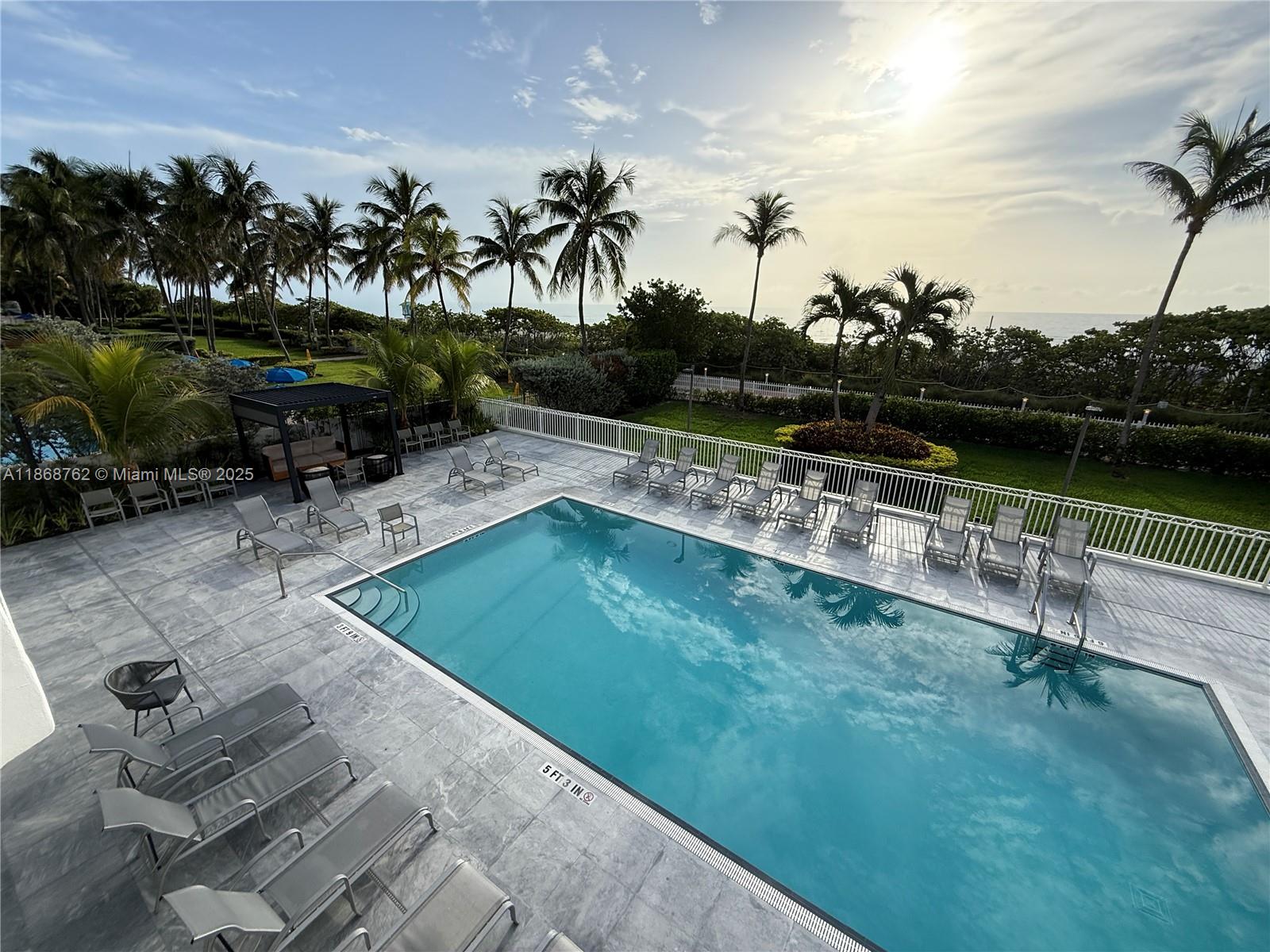 4301 Collins Avenue, Unit 208 Miami Beach, FL 33140 - Photo 1 of 28 a view of a swimming pool with a patio