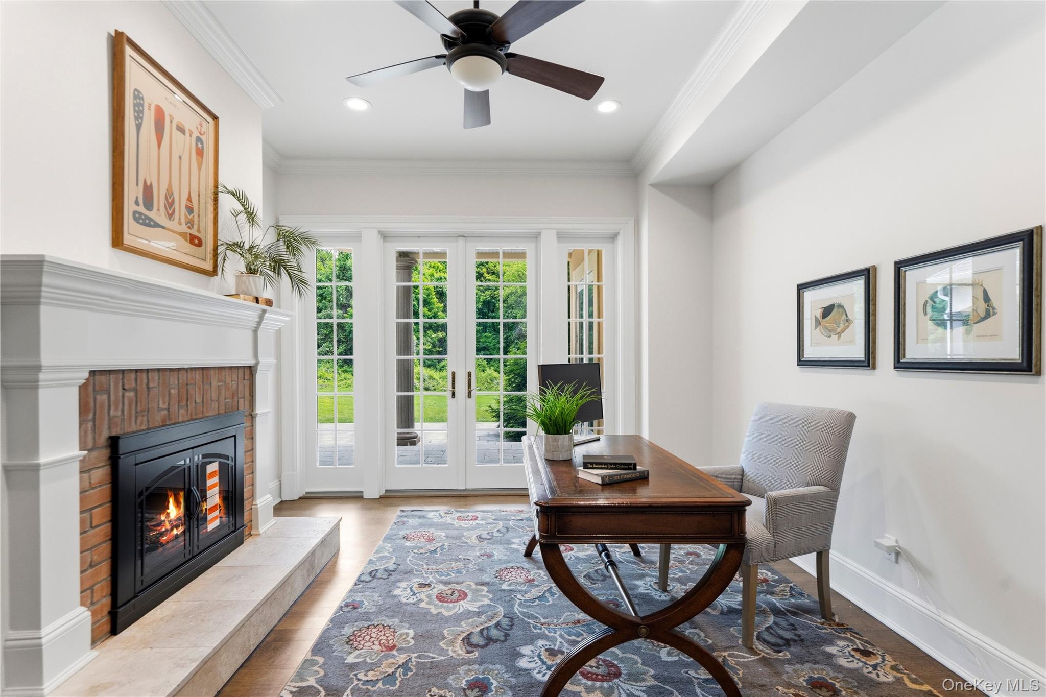 1960 Midlane Road South Syosset, NY 11791 - Photo 25 of 46 a living room with furniture a large window and a fireplace