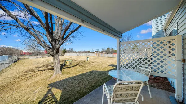 a view of balcony with furniture
