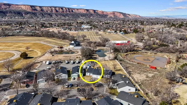an aerial view of a house with a swimming pool