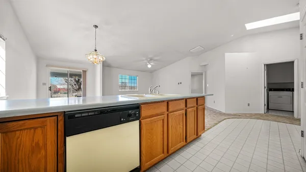 a kitchen with stainless steel appliances granite countertop a sink and cabinets