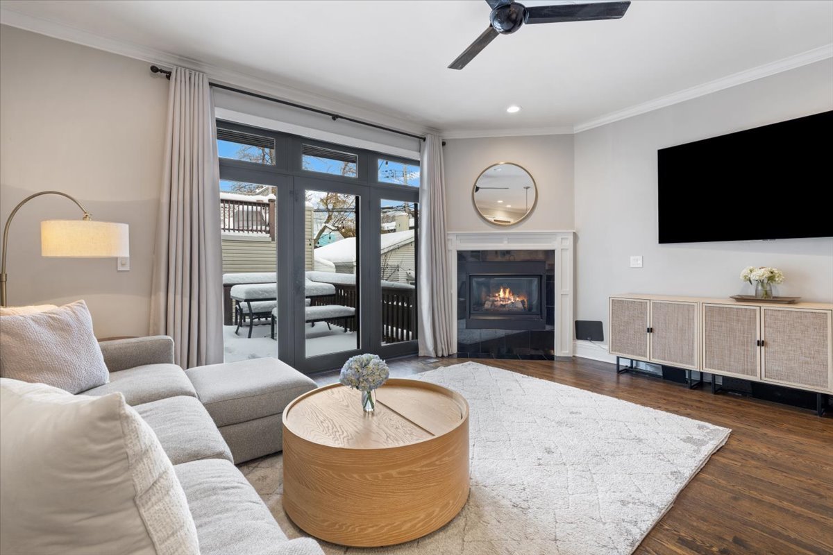 1920 West George Street Chicago, IL 60657 - Photo 14 of 36 a living room with furniture a flat screen tv and a fireplace