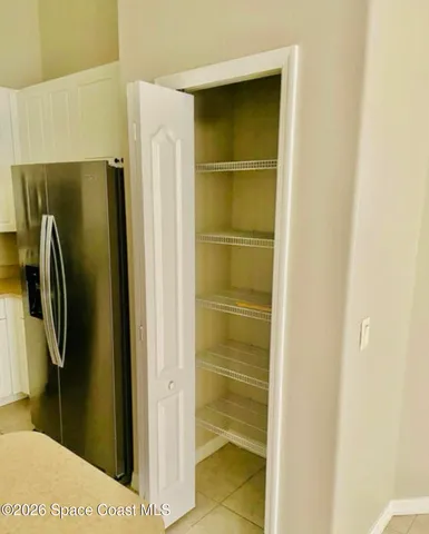 a bathroom with a double vanity sink toilet mirror and shower