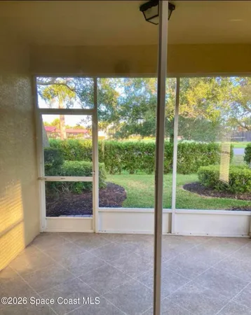 a view of a room with a large window and an outdoor view