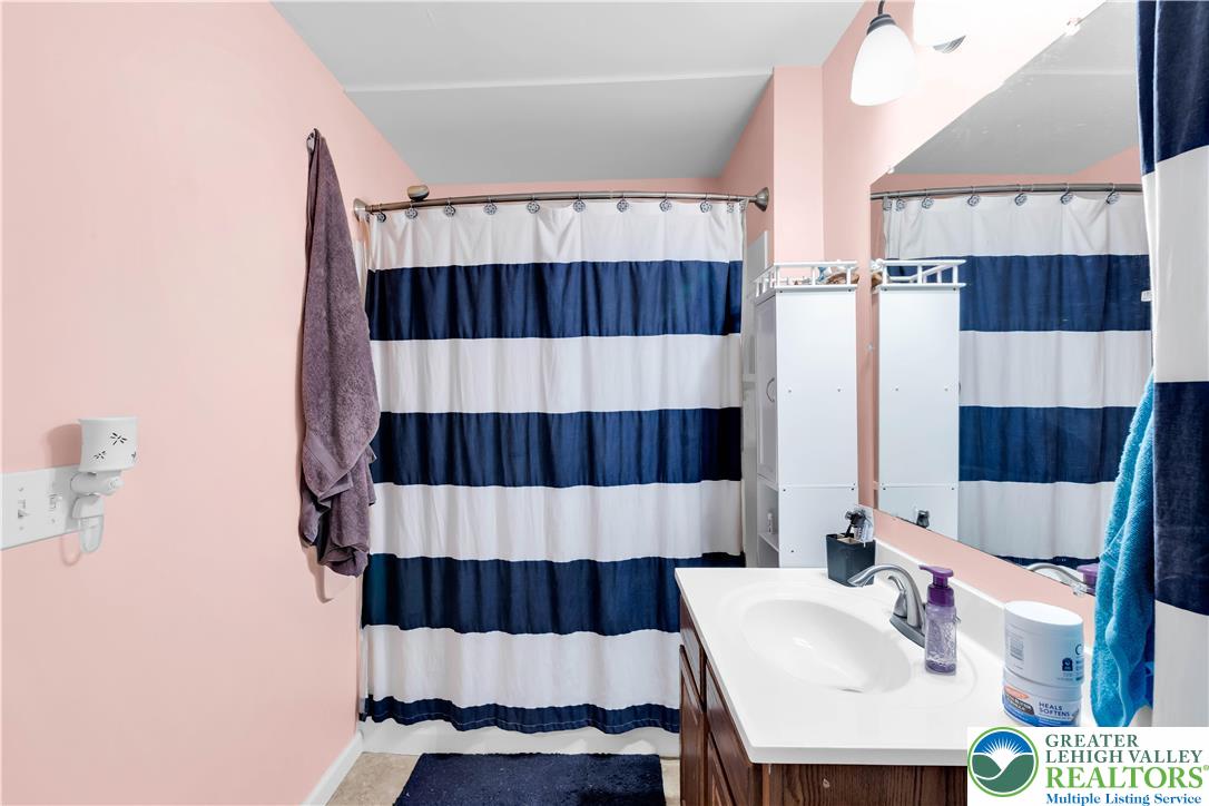 7281 Decatur Street New Tripoli, PA 18066 - Photo 15 of 24 a bathroom with a sink a toilet and shower