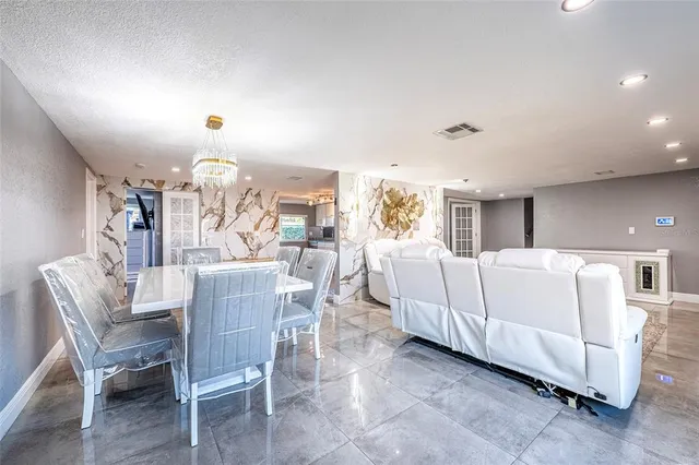 a bedroom with a bed and large window