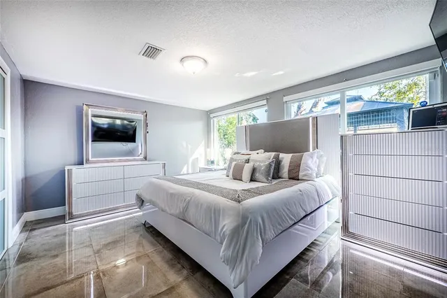 a bathroom with a sink toilet and a mirror