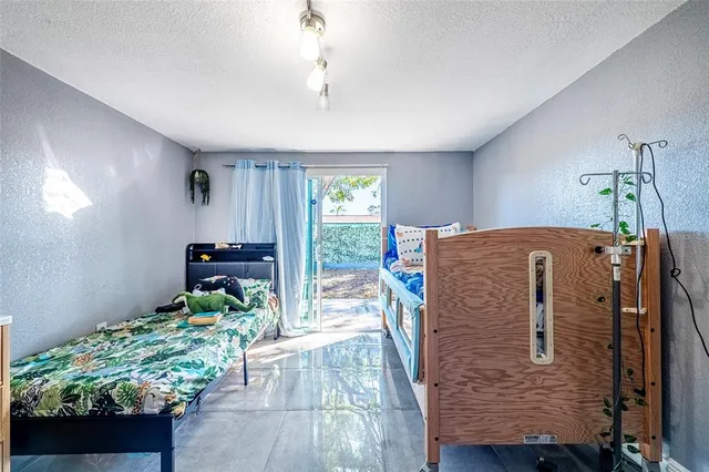 a kitchen with granite countertop white cabinets and stainless steel appliances