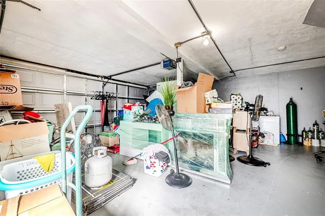 a view of a house that has a bed and a patio