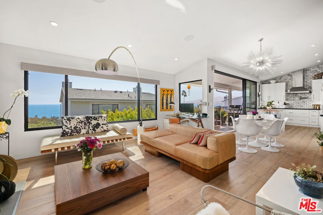 6795 Las Olas Way Malibu, CA 90265 - Photo 5 of 26 a living room with furniture and a large window