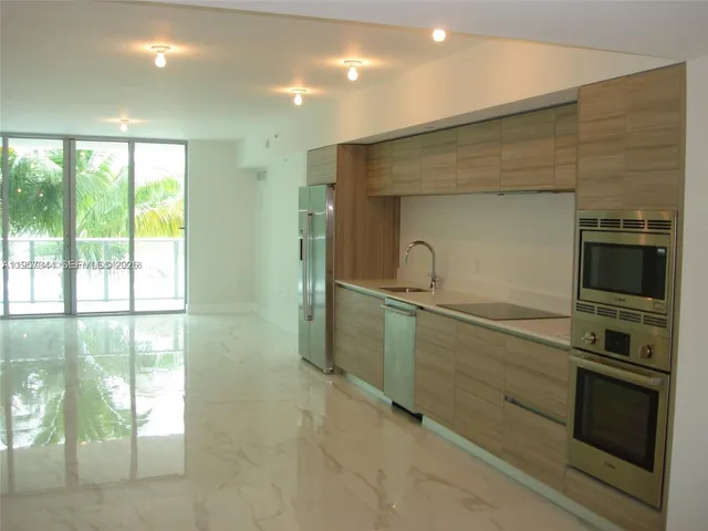 a kitchen with a sink and an oven