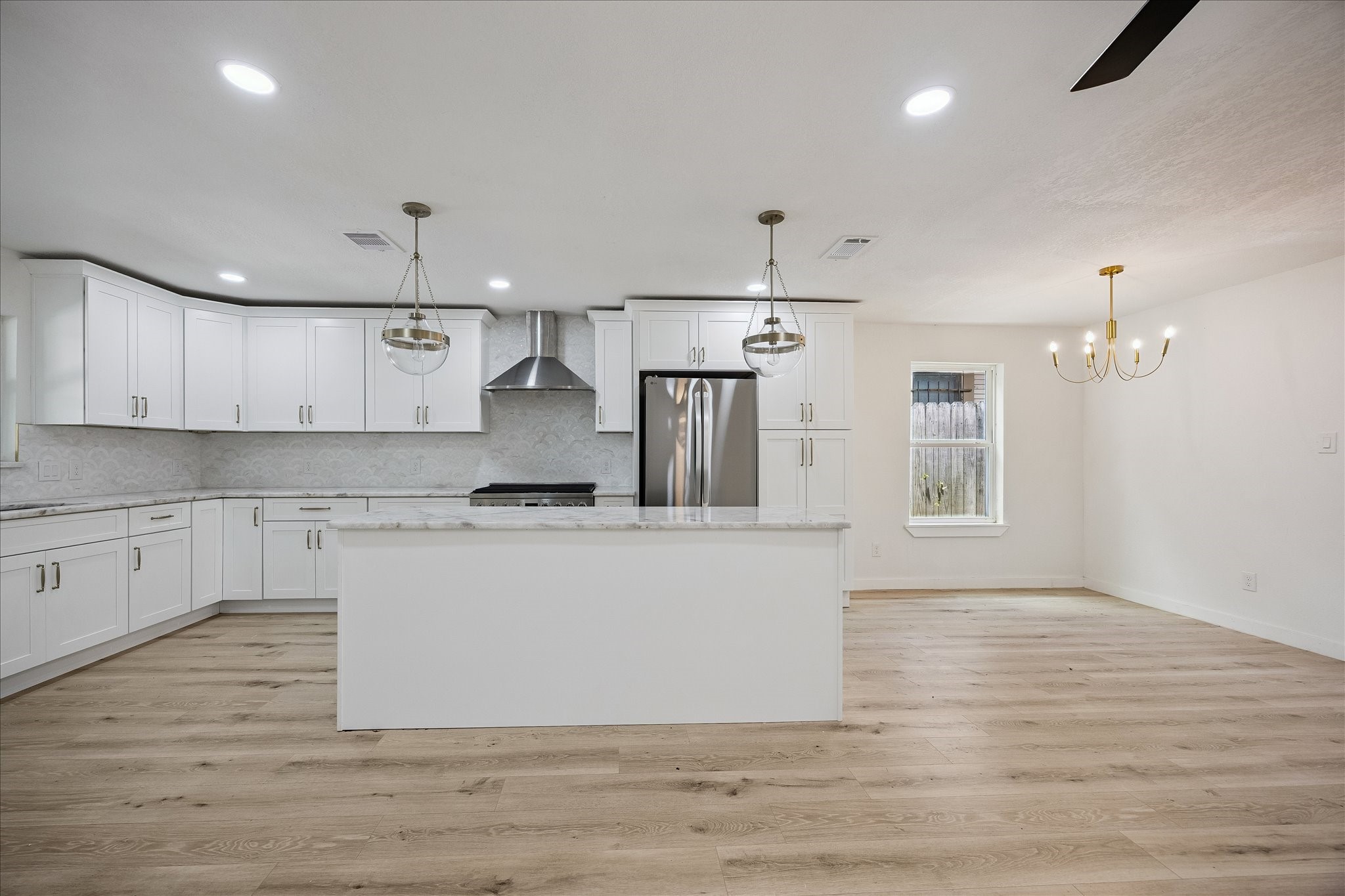 1630 Tabor Street Houston, TX 77009 - Photo 3 of 25 Open concept with the island opening up with the living space.