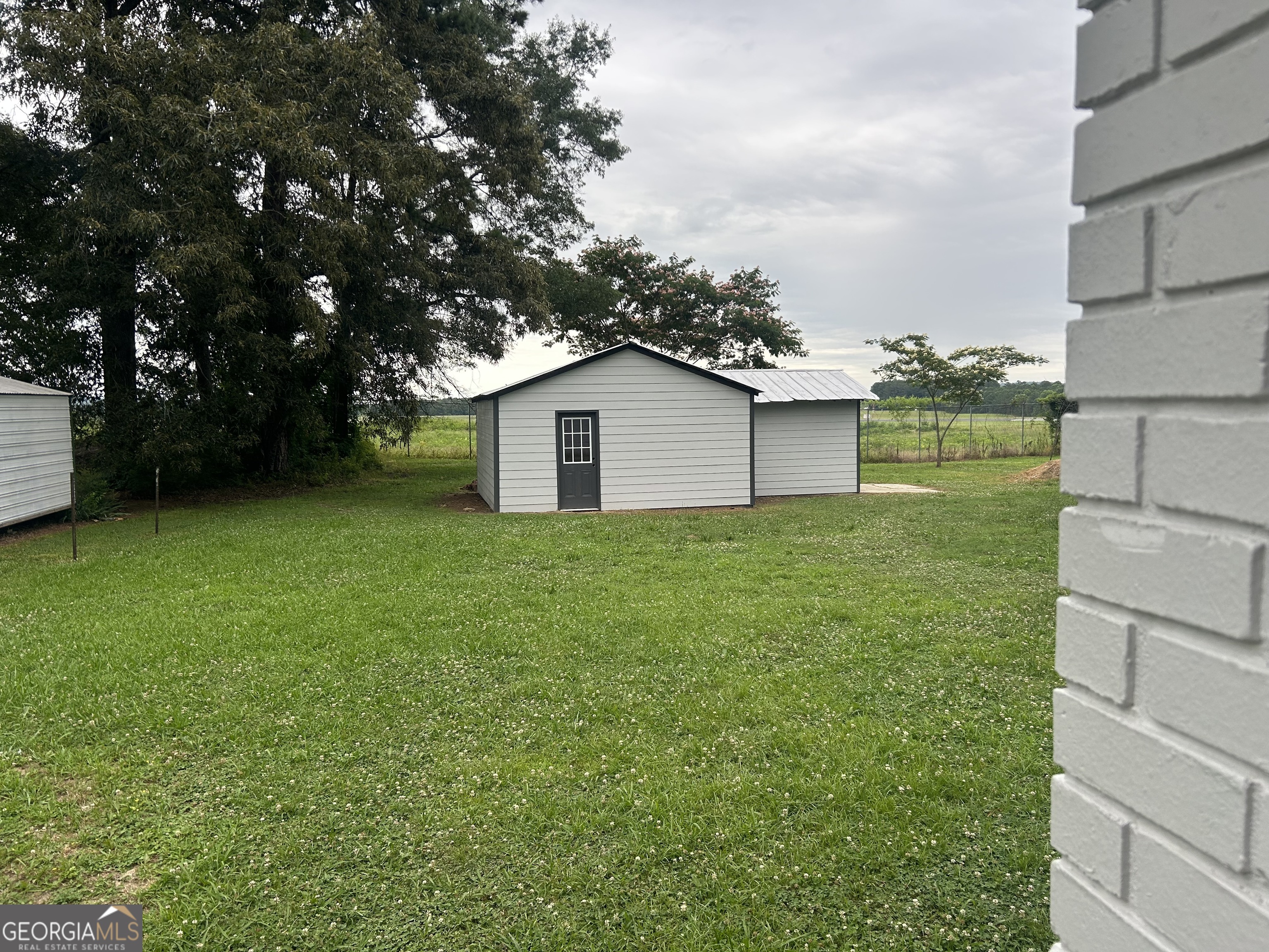 360 Warren Road Northeast Rome, GA 30165 - Photo 16 of 16 a house view with a garden space