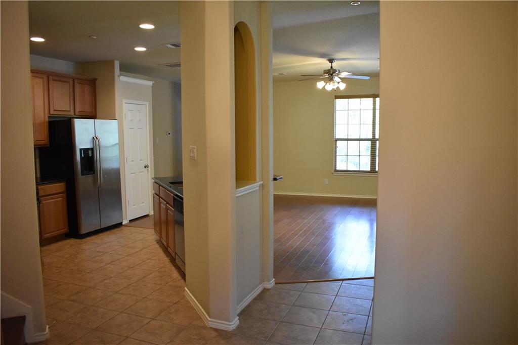 1310 West Parmer Lane, Unit 1503 Austin, TX 78727 - Photo 8 of 26 Kitchen featuring wood finish cabinets, stainless steel fridge with ice dispenser, recessed lighting, ceiling fan, and light tile patterned flooring