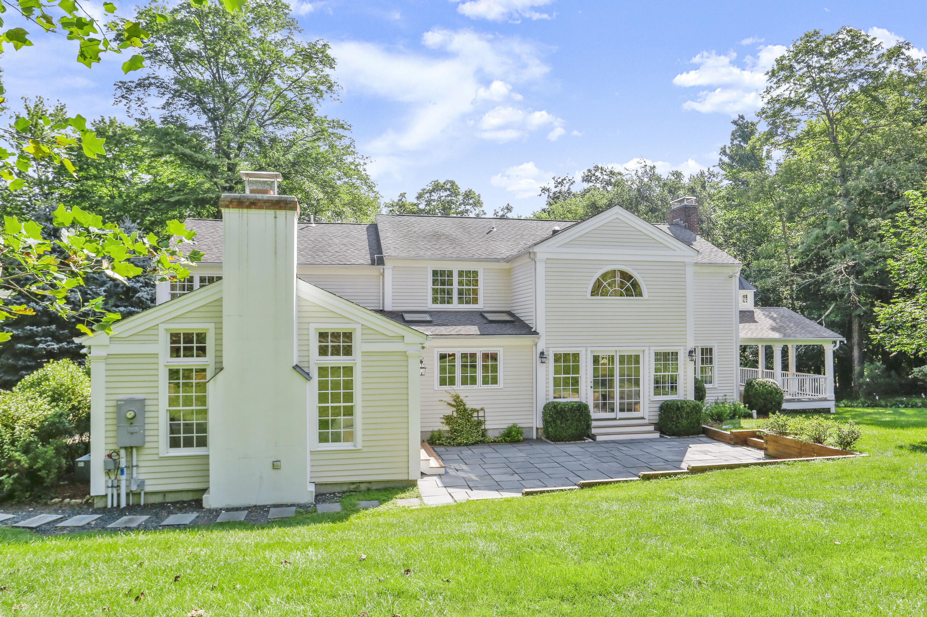 110 Sleepy Hollow Road New Canaan, CT 06840 - Photo 2 of 47 front view of a house with a yard