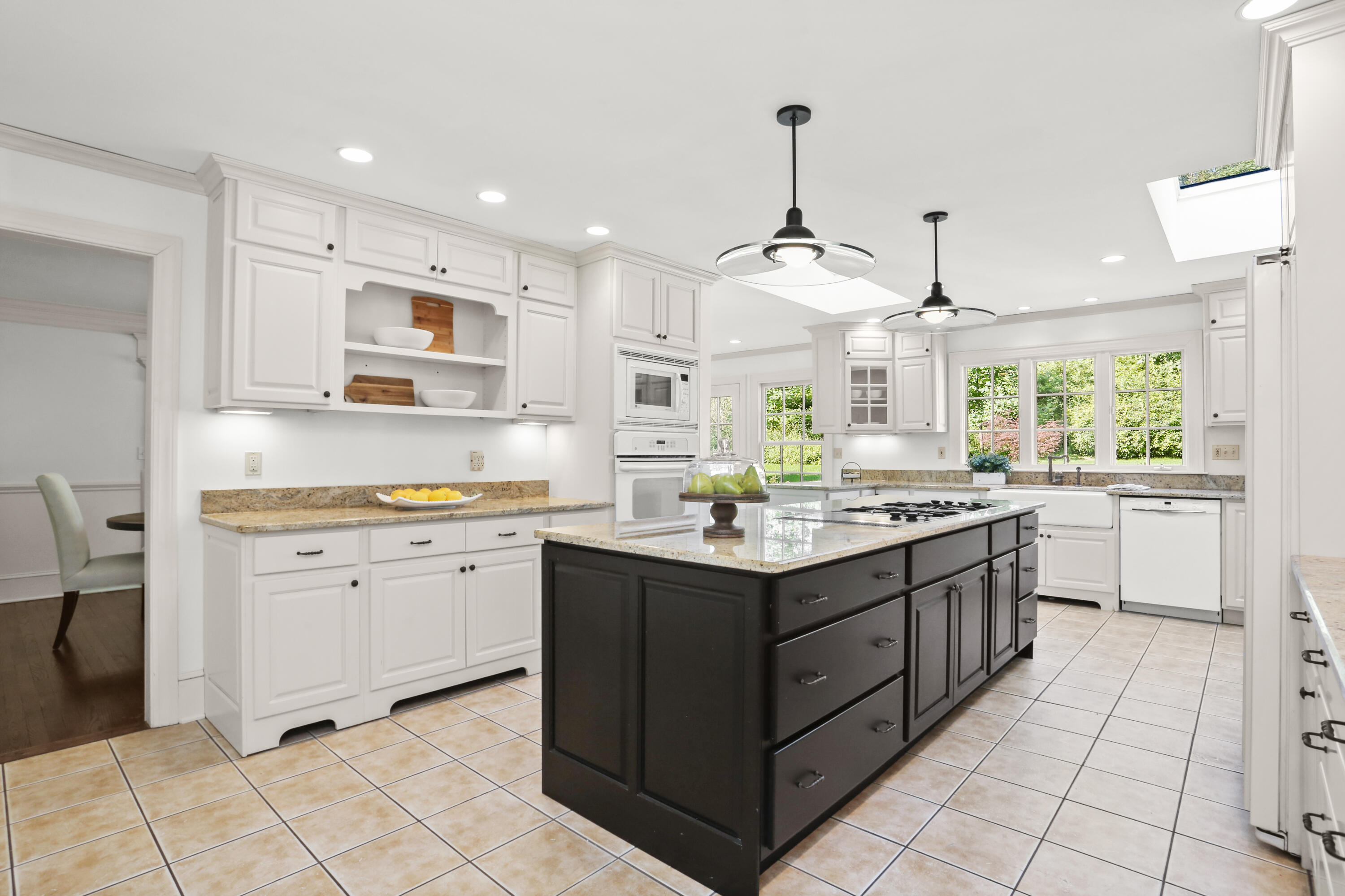 110 Sleepy Hollow Road New Canaan, CT 06840 - Photo 12 of 47 a kitchen with stainless steel appliances granite countertop a sink and a stove