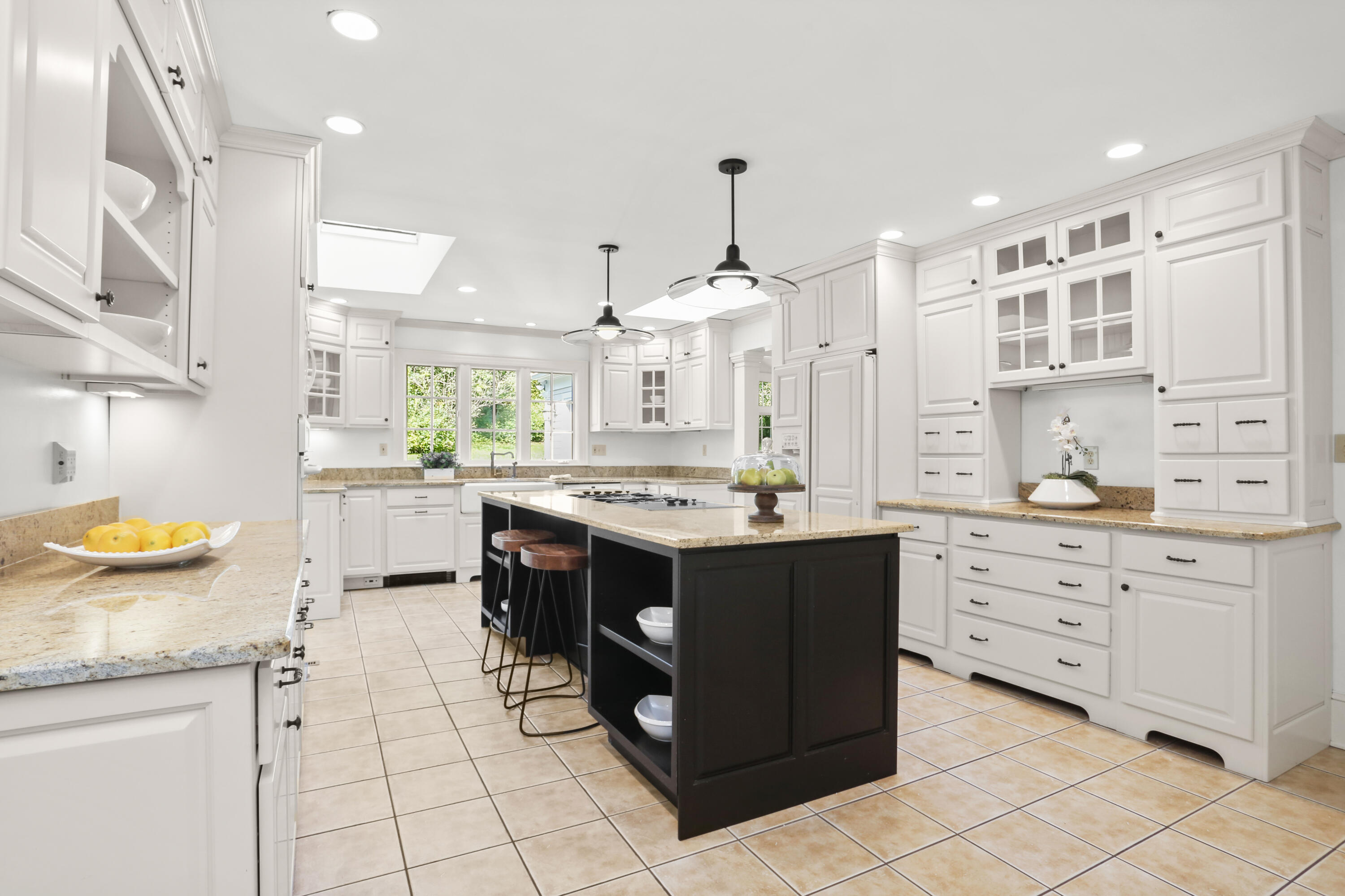 110 Sleepy Hollow Road New Canaan, CT 06840 - Photo 14 of 47 a kitchen with stainless steel appliances kitchen island granite countertop a stove and a sink