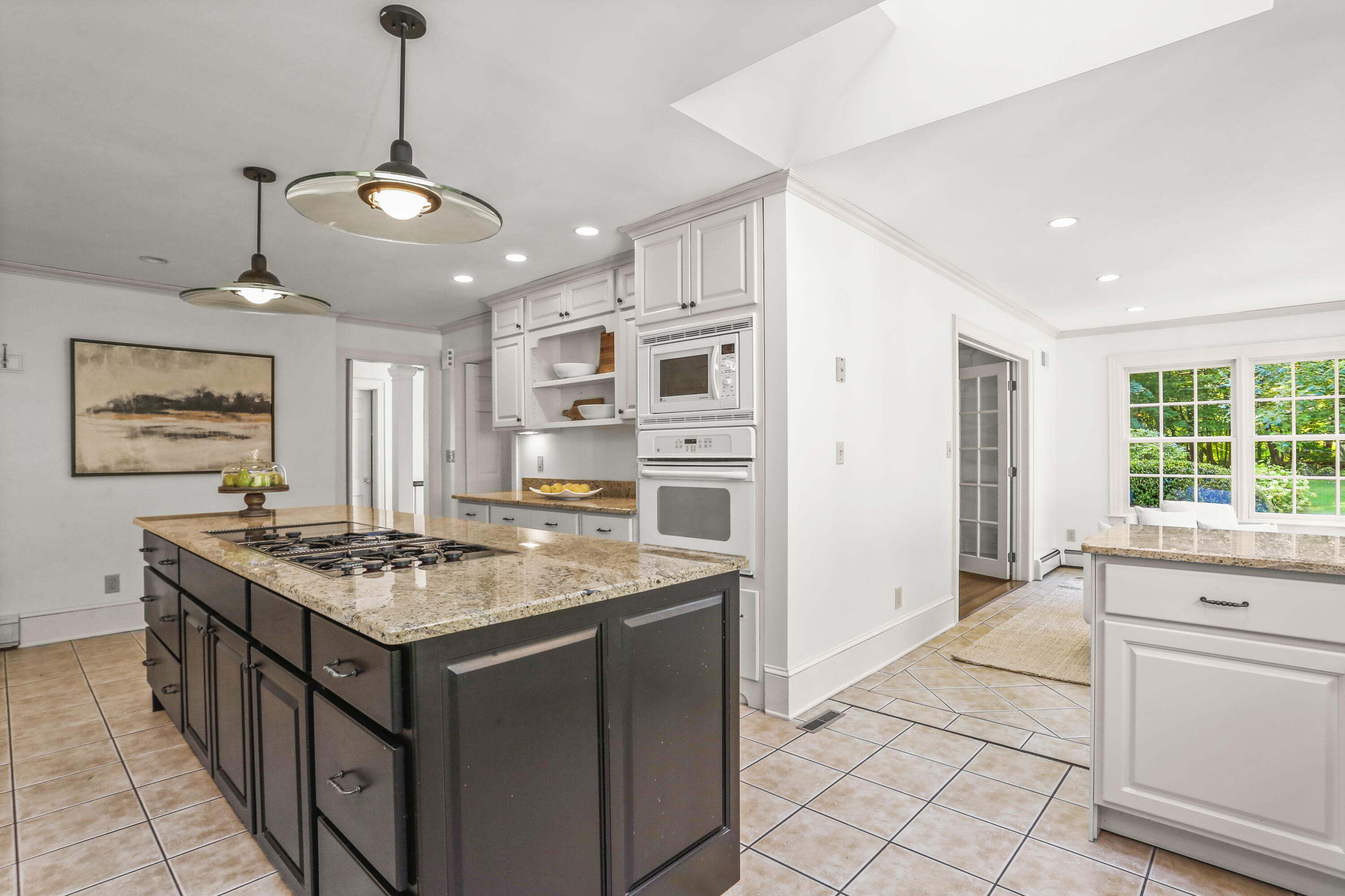 110 Sleepy Hollow Road New Canaan, CT 06840 - Photo 15 of 47 a kitchen with stainless steel appliances granite countertop a stove and a refrigerator