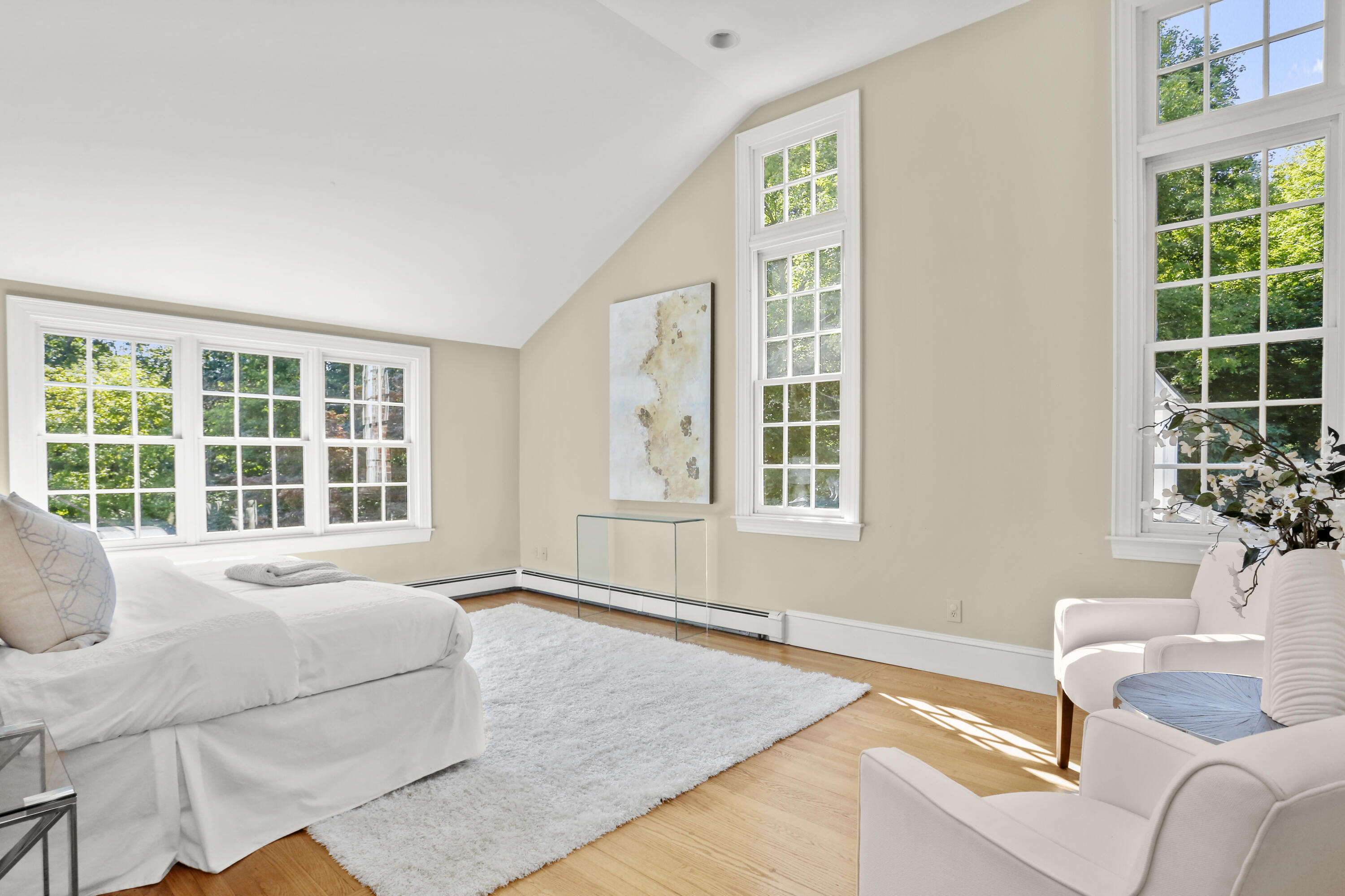 110 Sleepy Hollow Road New Canaan, CT 06840 - Photo 19 of 47 a spacious bedroom with a bed and a large window