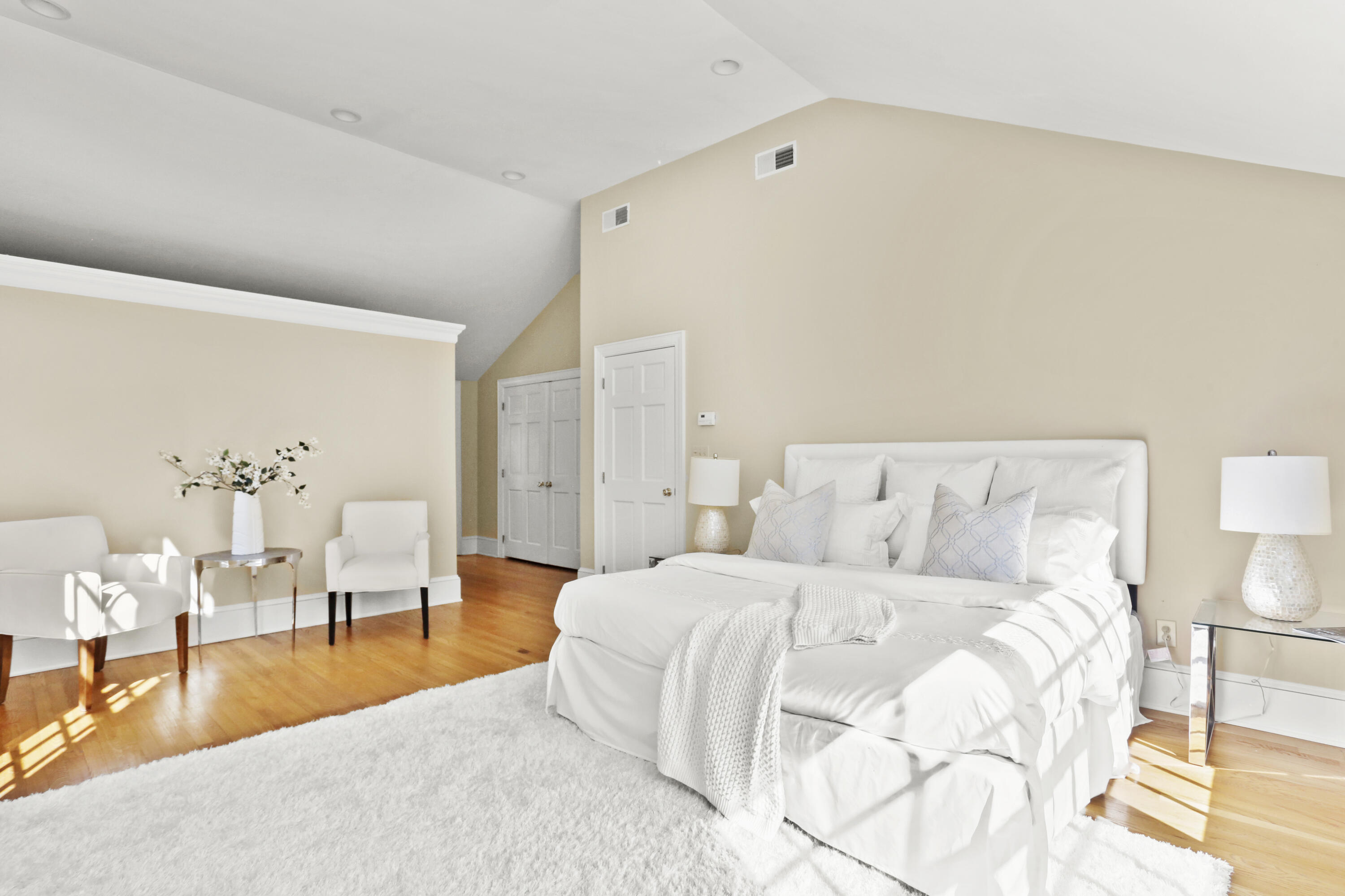 110 Sleepy Hollow Road New Canaan, CT 06840 - Photo 20 of 47 a bedroom with a large bed and a lamp on table