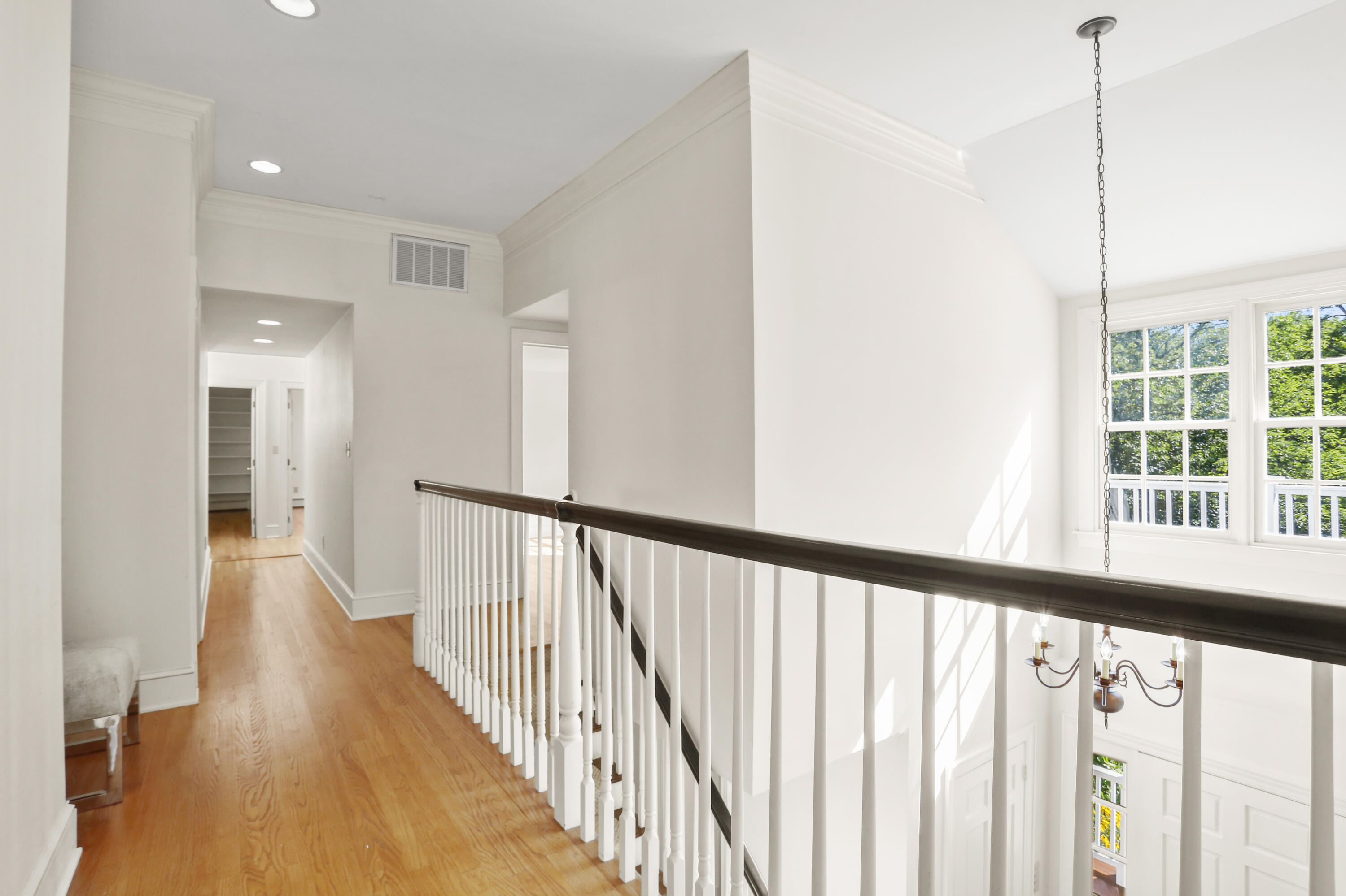 110 Sleepy Hollow Road New Canaan, CT 06840 - Photo 24 of 47 a view of a hallway with wooden floor and windows