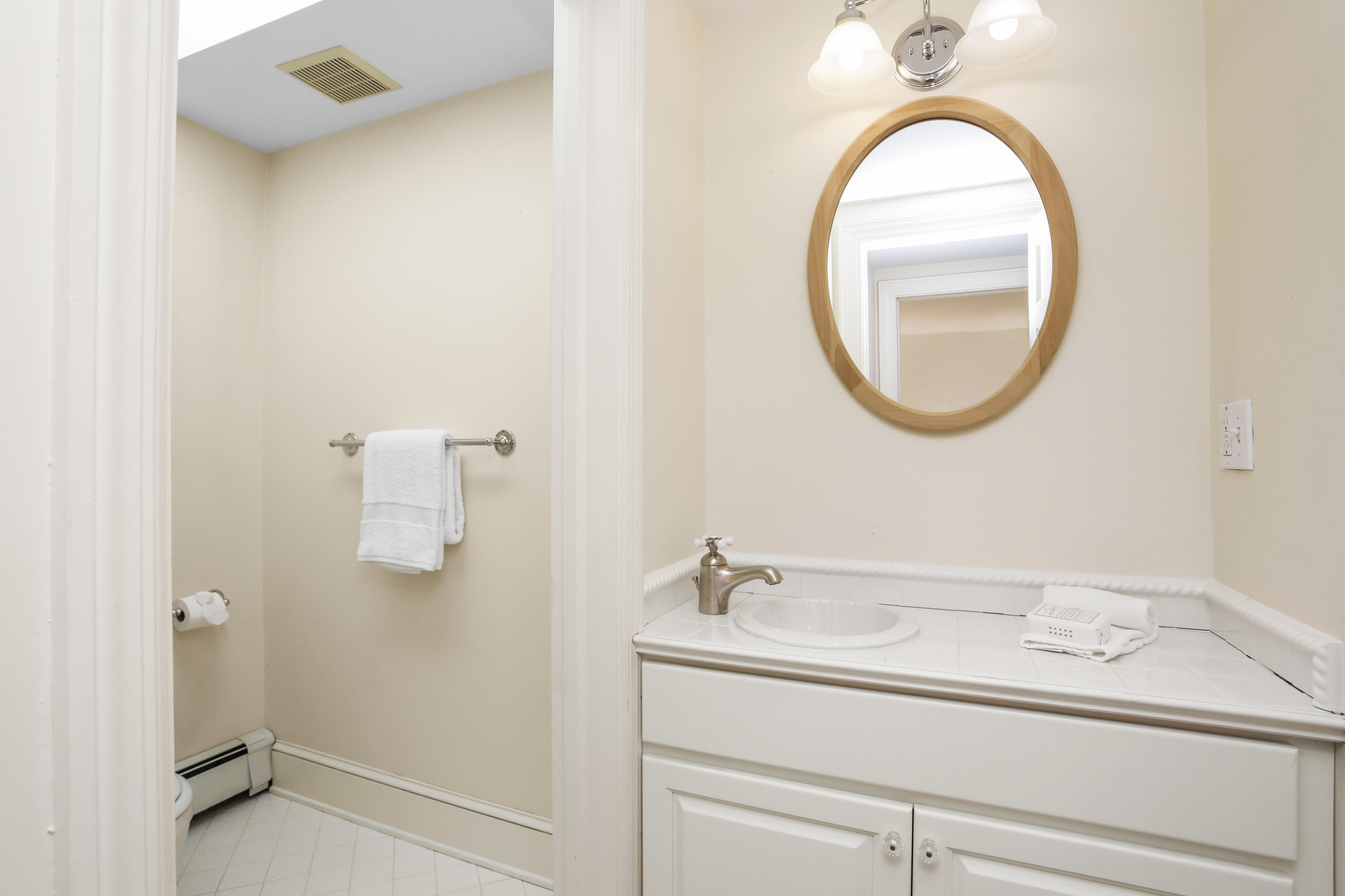 110 Sleepy Hollow Road New Canaan, CT 06840 - Photo 26 of 47 a bathroom with a sink and a mirror