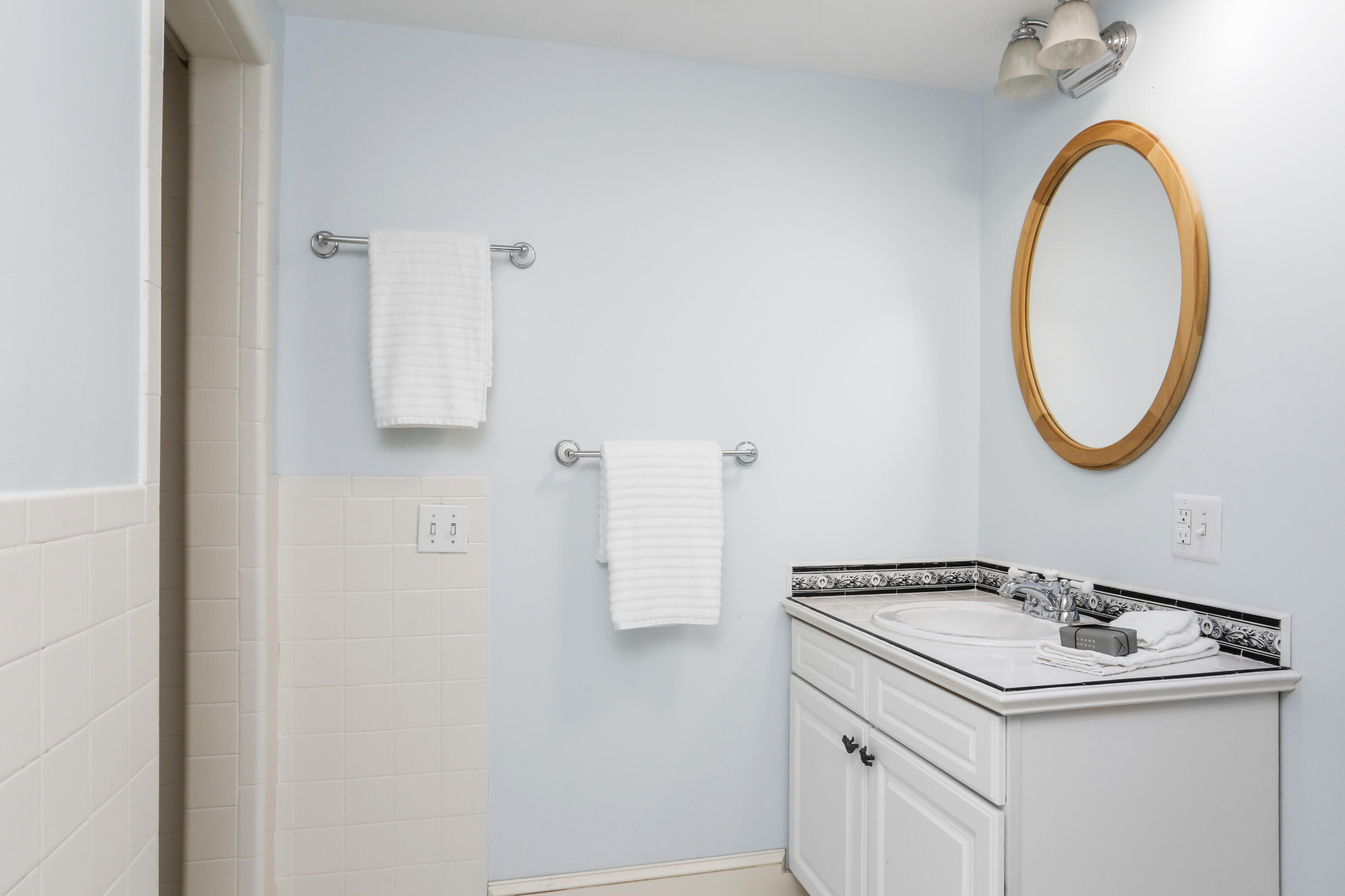 110 Sleepy Hollow Road New Canaan, CT 06840 - Photo 28 of 47 a bathroom with a sink and a mirror
