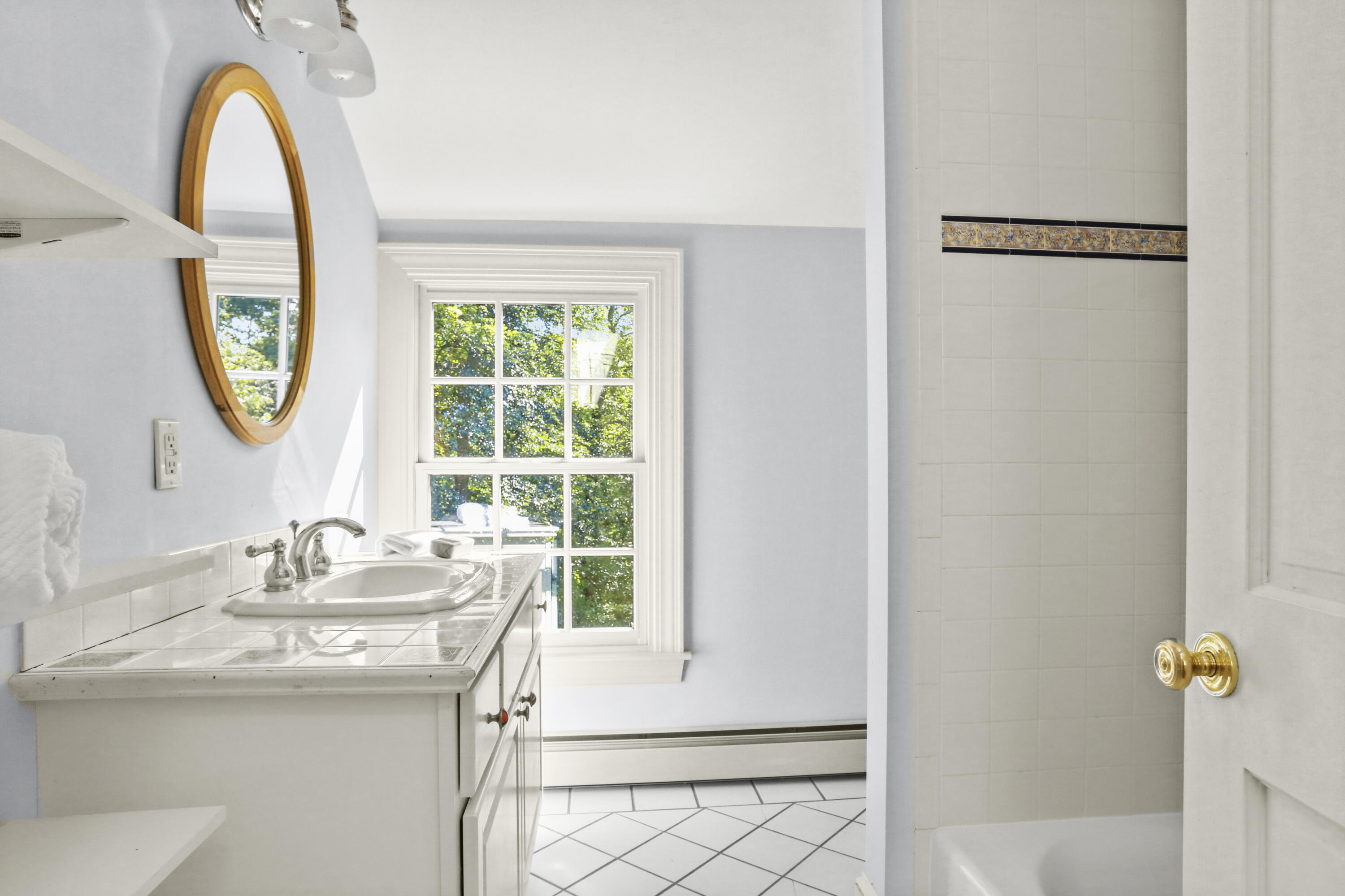 110 Sleepy Hollow Road New Canaan, CT 06840 - Photo 30 of 47 a bathroom with a granite countertop sink a mirror and a window