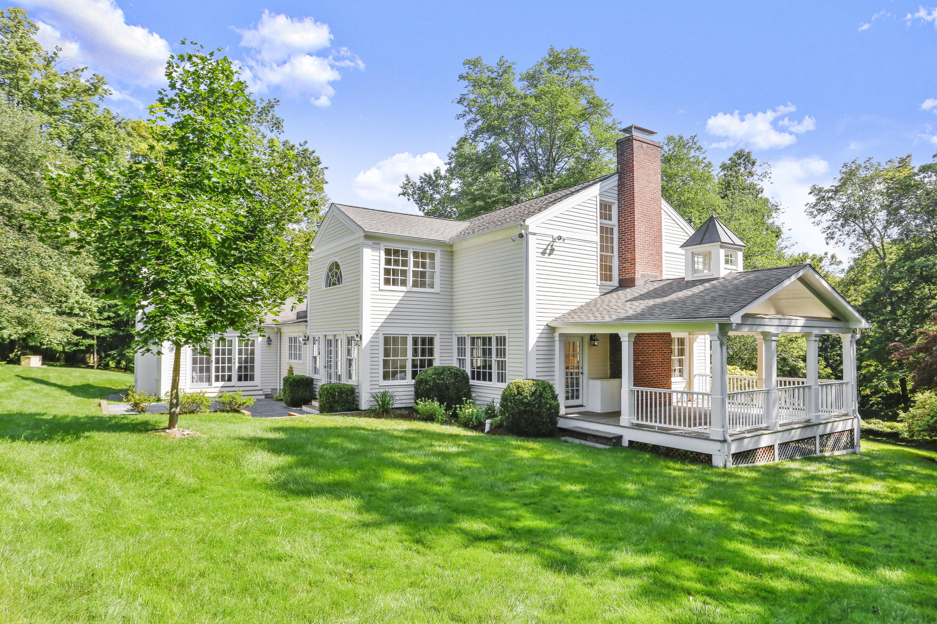 110 Sleepy Hollow Road New Canaan, CT 06840 - Photo 37 of 47 a front view of house with yard and green space