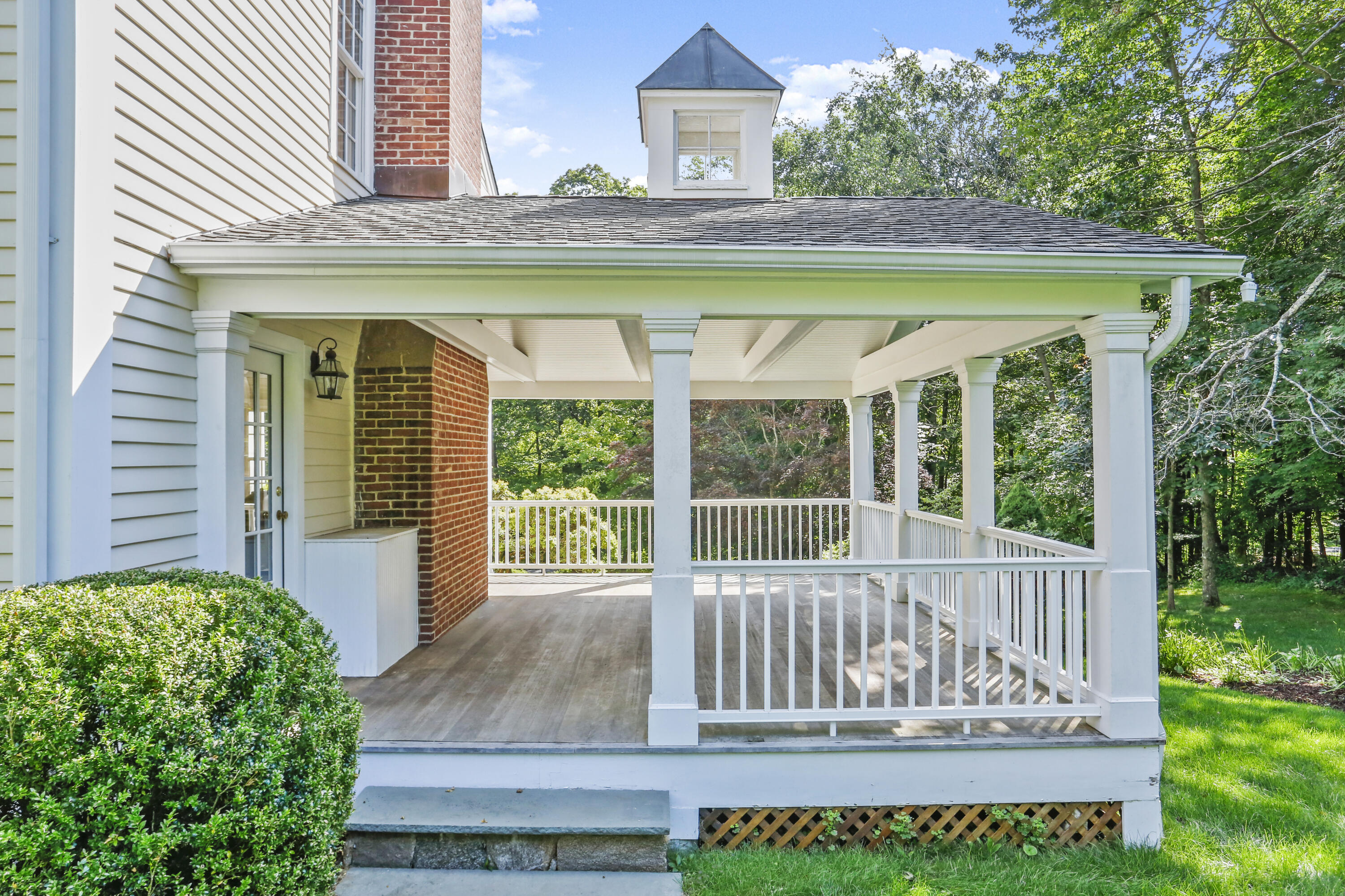 110 Sleepy Hollow Road New Canaan, CT 06840 - Photo 38 of 47 a view of a house with a yard and wooden deck