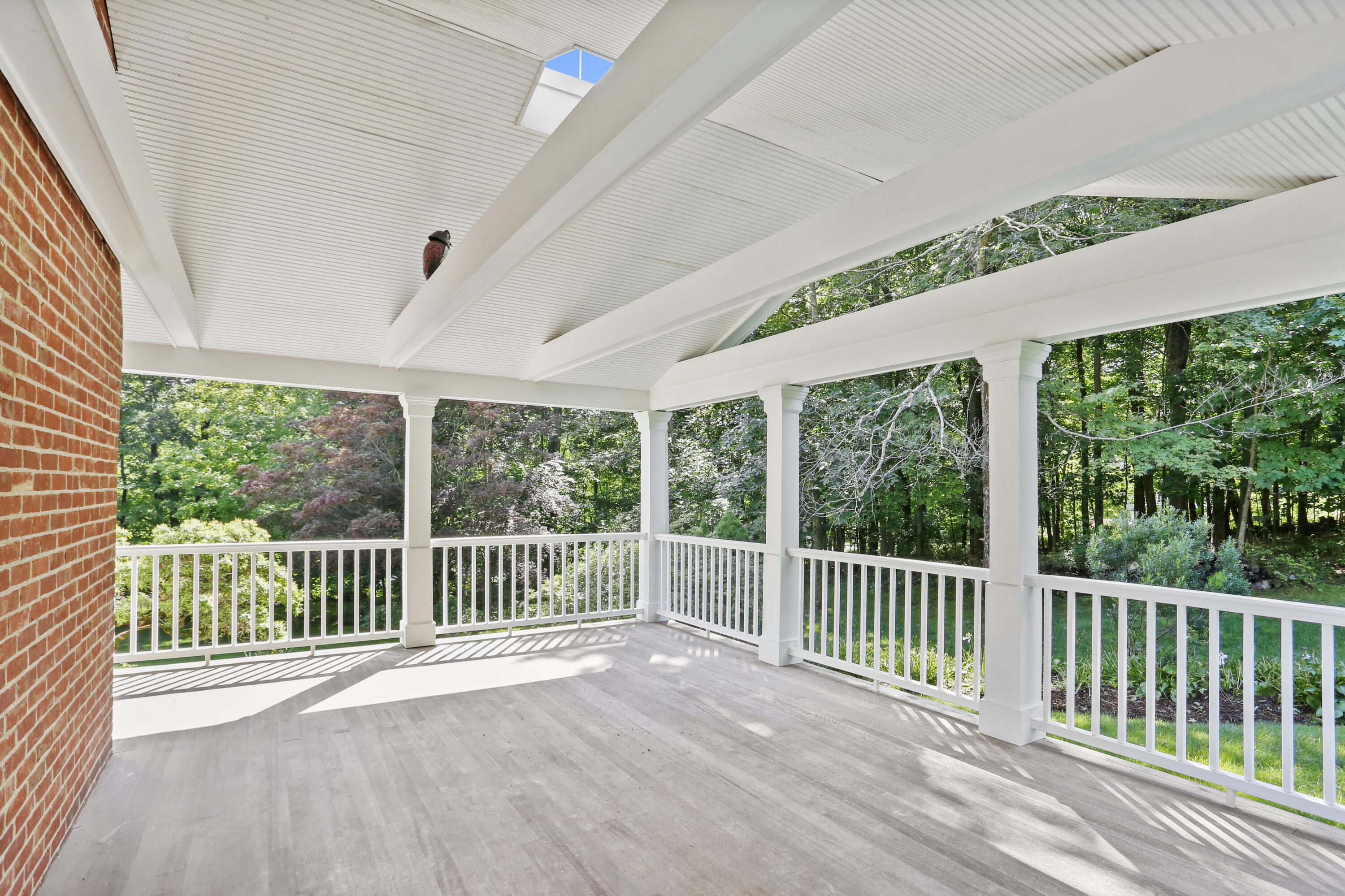 110 Sleepy Hollow Road New Canaan, CT 06840 - Photo 39 of 47 an empty room with wooden floor and balcony