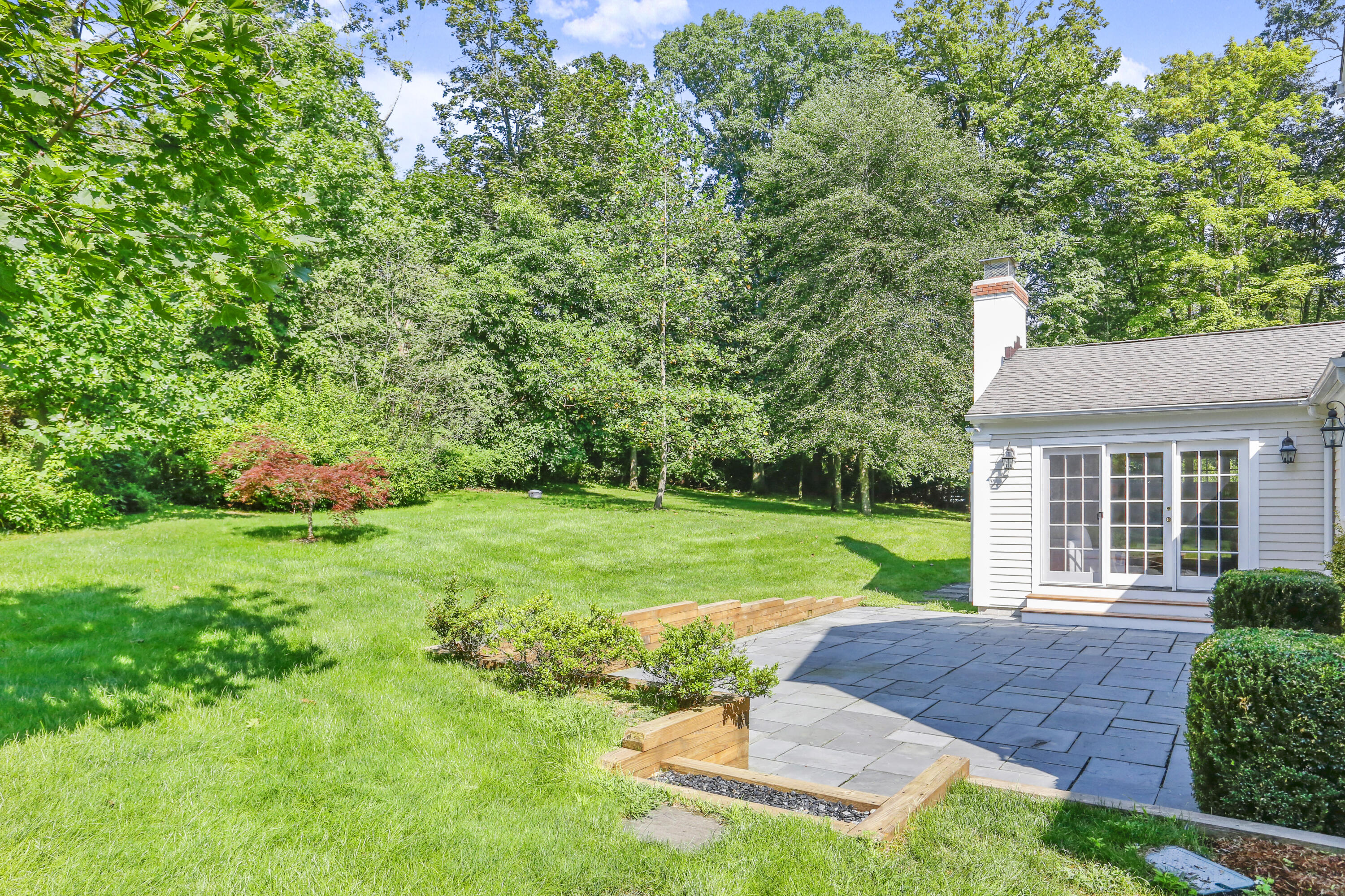 110 Sleepy Hollow Road New Canaan, CT 06840 - Photo 40 of 47 a front view of a house with garden