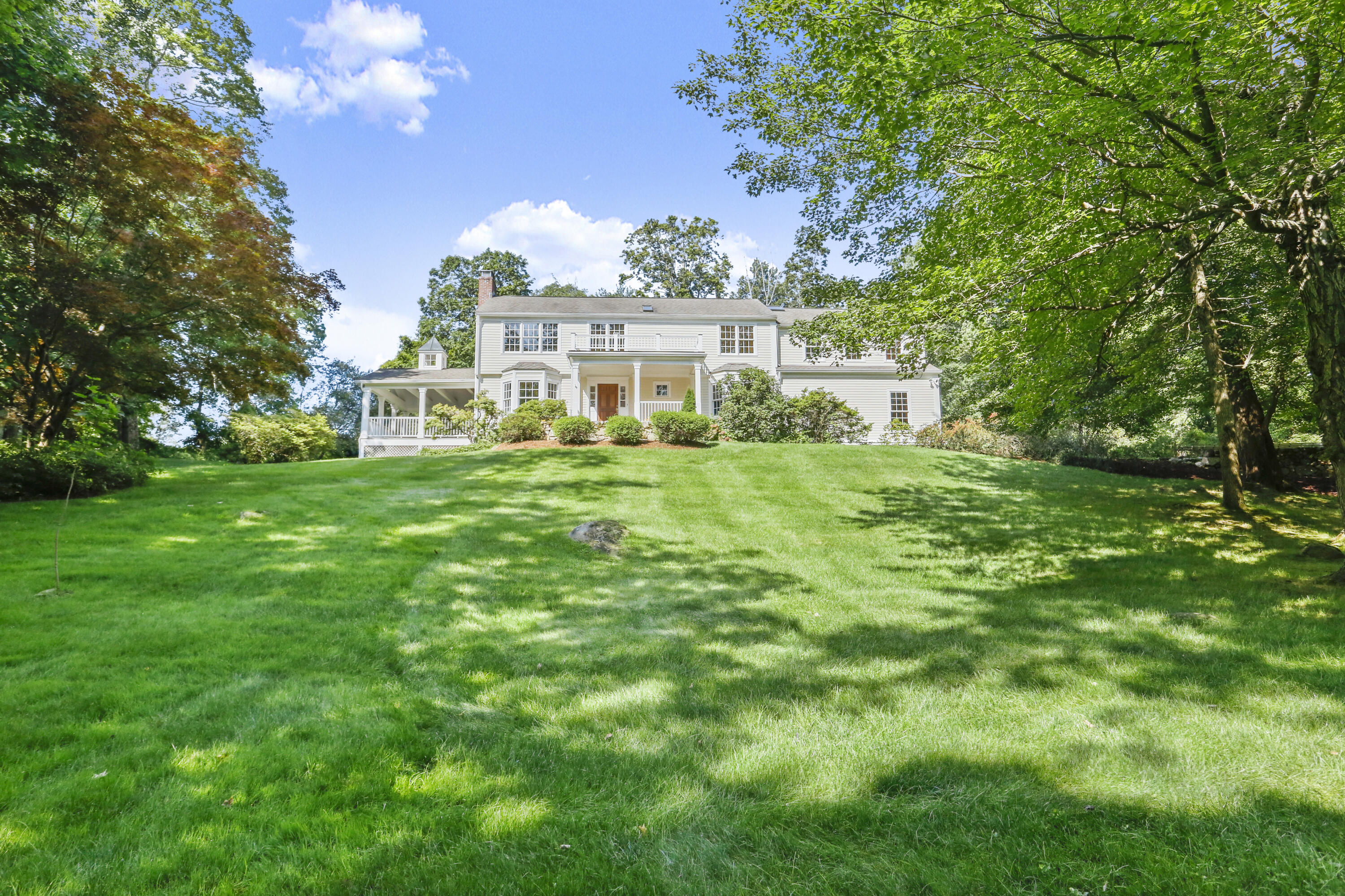 110 Sleepy Hollow Road New Canaan, CT 06840 - Photo 43 of 47 a view of a house with a big yard
