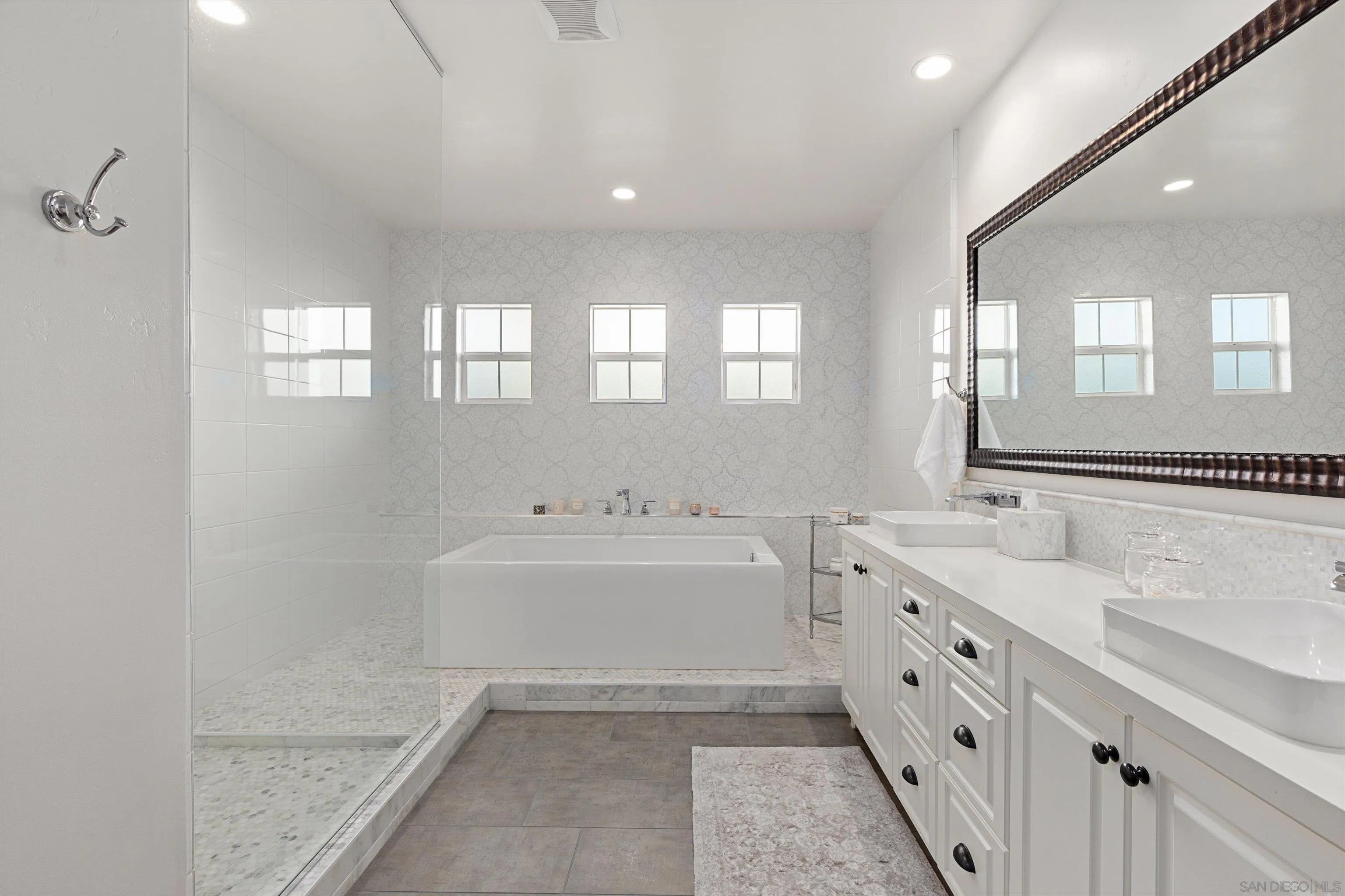 869 Channel Island Drive Encinitas, CA 92024 - Photo 12 of 21 a bathroom with double vanity sink a mirror and a bathtub